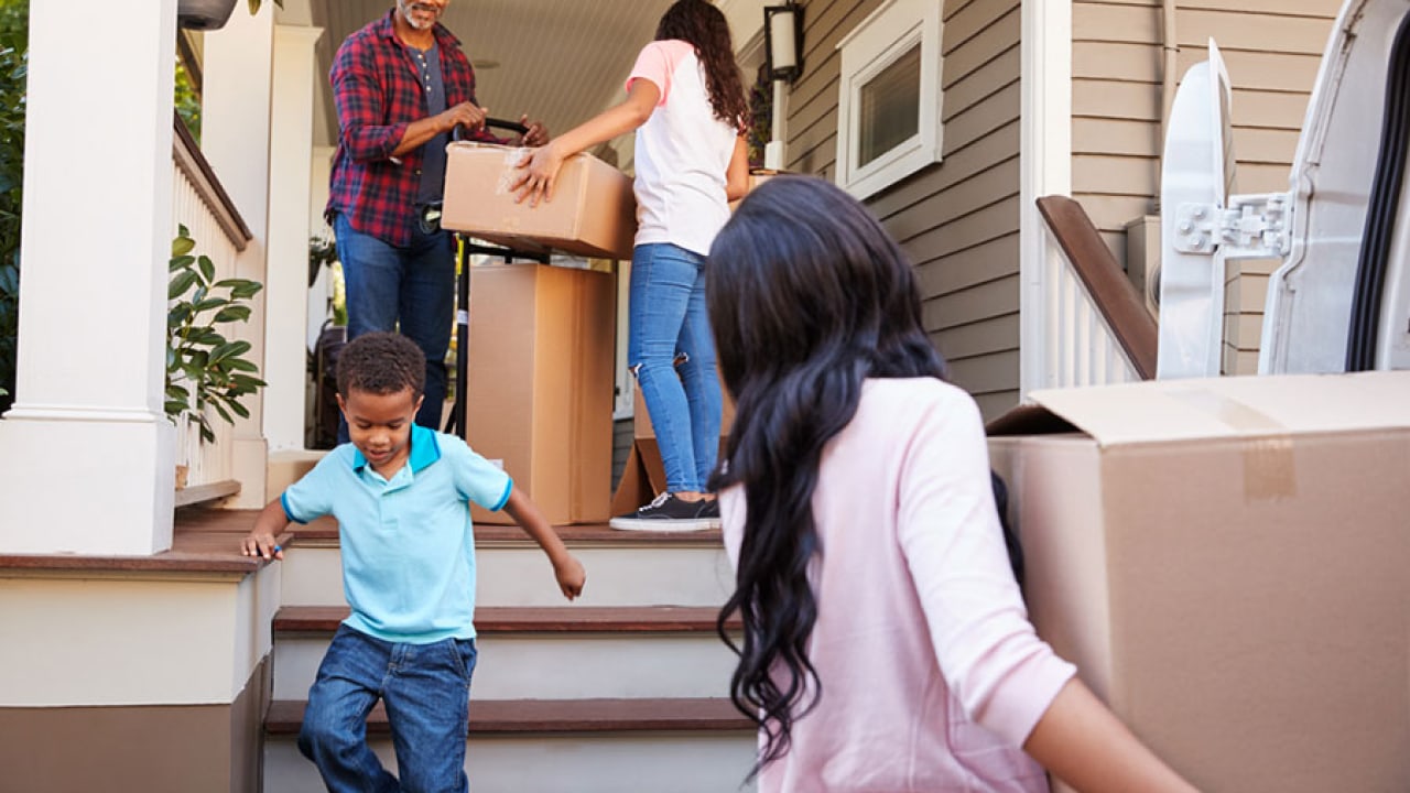 Family with moving boxes