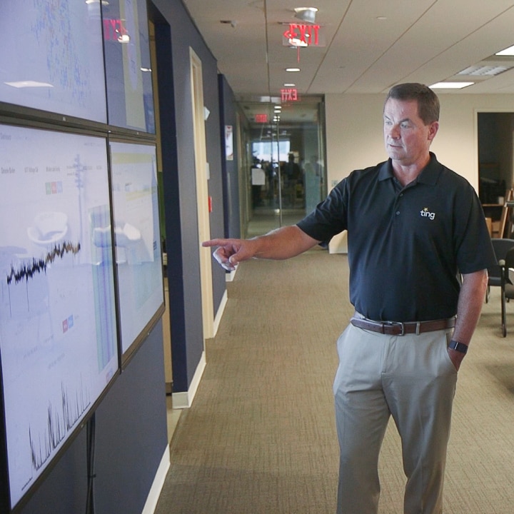 whisker-labs-team-board Bob Marshall pointing at graphs