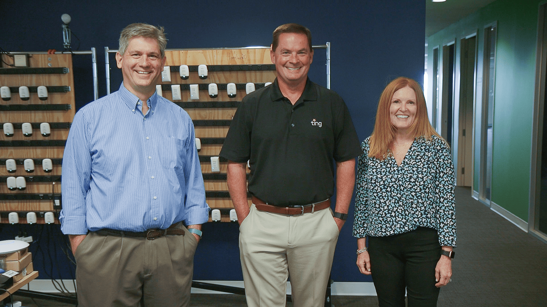 Bob, Jenny, and Chris in front of a display of Ting sensors